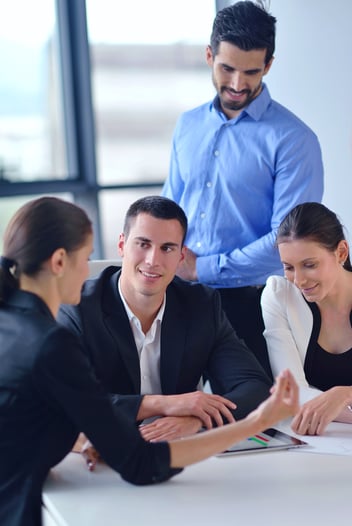 Group of happy young  business people in a meeting at office-1