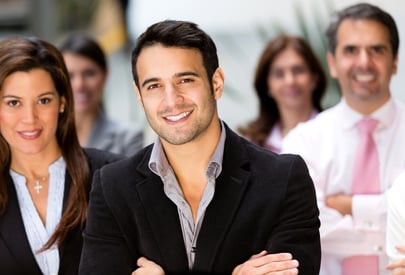 Happy business group at the office smiling